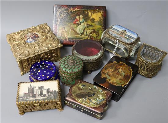 A foliate-scrolled gilt-metal jewellery casket, inset porcelain plaque and nine other decorative boxes,
